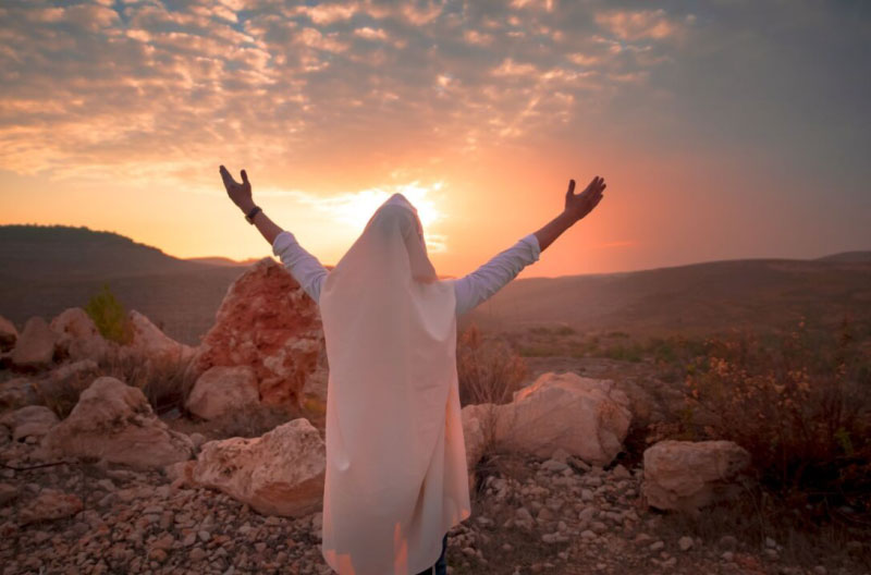Jewish men prayer With Talit and tefillin in sunset esperanza